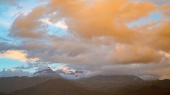 Sunset in the Mountains During the Fog and Torrential Rain