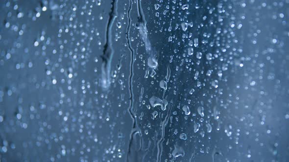 Drops of water on blue background