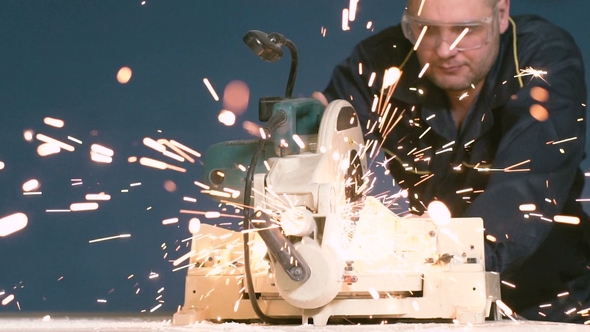 During Welding of Metal Pipe, the Working Sparks Fly To the Camera