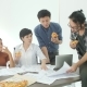 Casual Creative Business Team Having Lunch While Meeting in Office - VideoHive Item for Sale