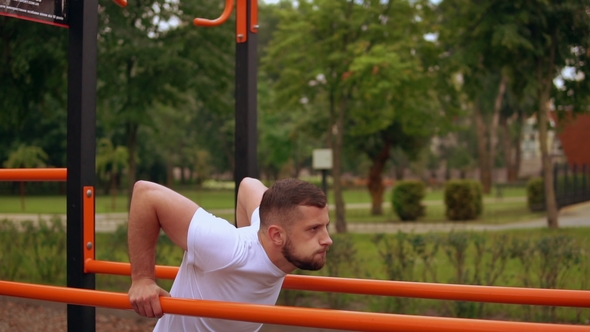 Side View of a Man Doing Push Ups