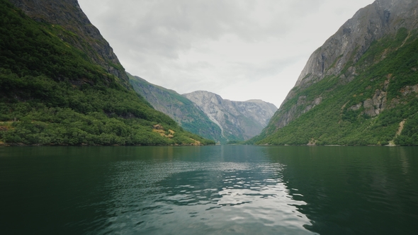 Fly Low Over the Surface of the Water in the Picturesque Fjord of Norway