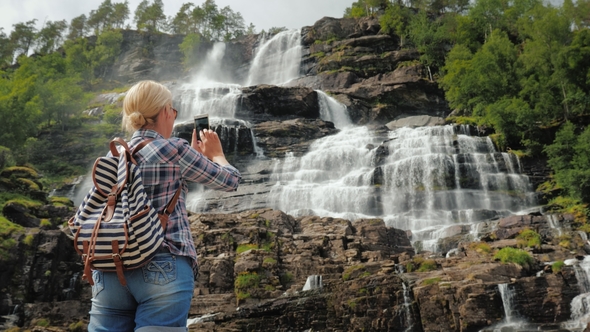 The Tourist Photographs the Highest Waterfall in Norway. According To Legend, the Water From This