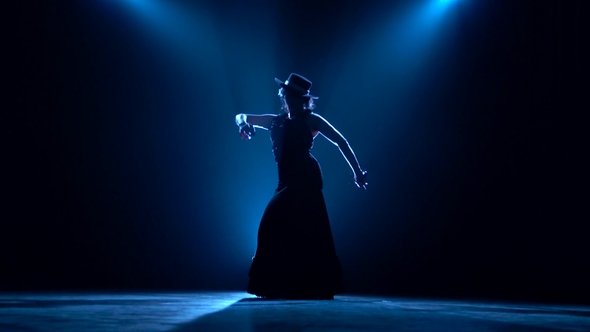 Girl Dances Flamenco. Blue Background. Silhouette