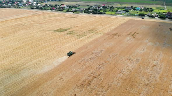 Combine Harvests Wheat