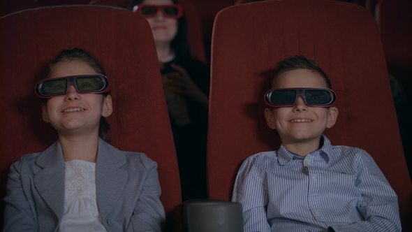 Excited Kids Watching Cartoon in 3D Movie Theater