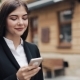Young Beautiful Business Woman Using Smartphone and Walking on the Old Street - VideoHive Item for Sale