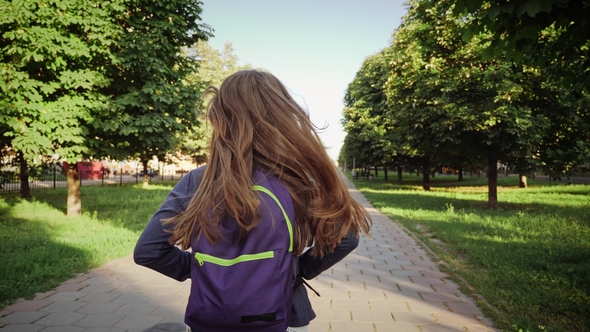 A Girl Running with a School Bags