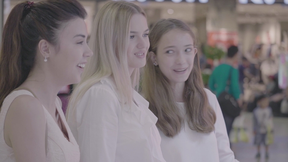 Gossip Friends Girls Talking in Shopping Mall