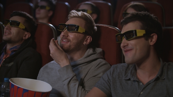 Man Friends Eating Popcorn at 3d Cinema Movie