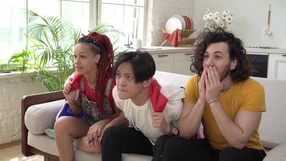 A Group of Fans of the Thai National Team are Watching Sports at Home