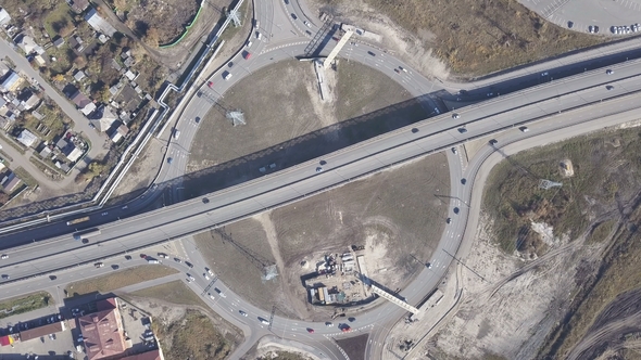 A Huge Roundabout Full of Cars and Trucks