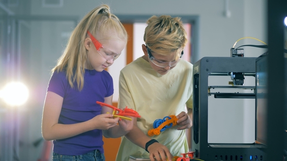 Two Curious Children Are Making Up Elements for an Experimental Mechanism