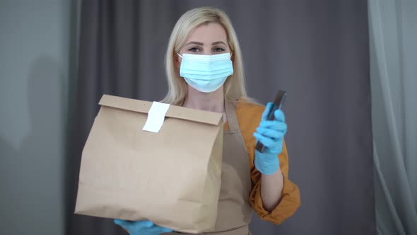 Health Protection Safety and Pandemic Concept  Delivery Woman in Face Protective Mask and Gloves