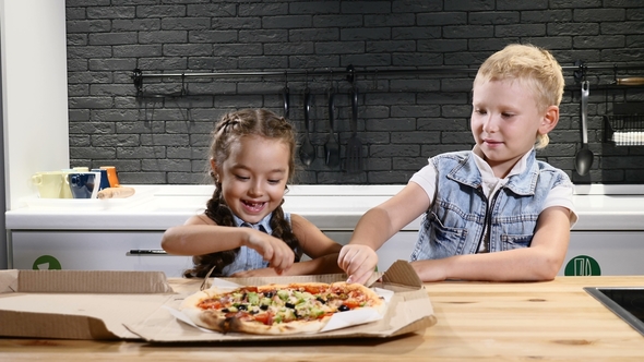 Two Children Eating Pizza Trying First Piece