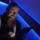 Bearded Man is Surfing the Internet While Using Tablet - VideoHive Item for Sale
