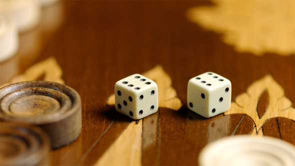 Sixes on Dices on the Backgammon Surface