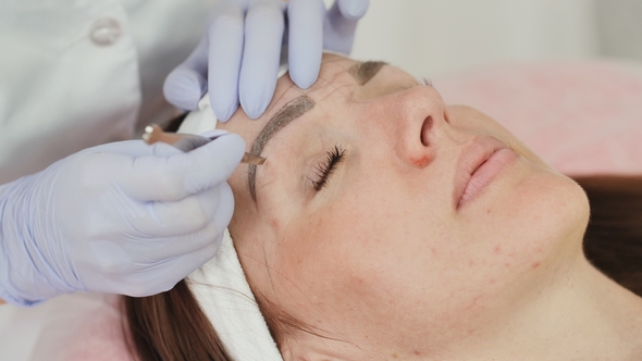 Part of Face, Woman Plucking Eyebrows Depilating with Tweezers