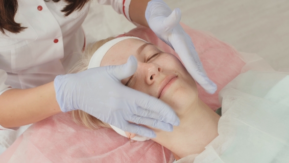 Massage the Face of the Girl in the Salon