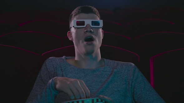 Man in 3d Glasses Eating Popcorn Wathing Cinema