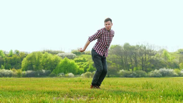 Crazy Successful Man Funny Dancing in the Green Field