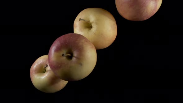 Flying Apples on a Black Background