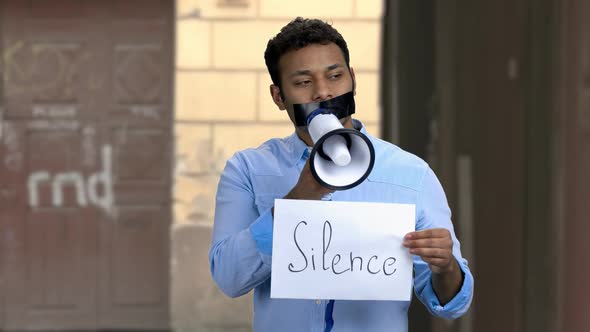 Silenced Male Protester with Megaphone