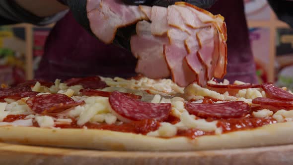 Close Up View of a Man Chef Cooking Italian Pizza. The Process of Making Pizza at Table . Fresh