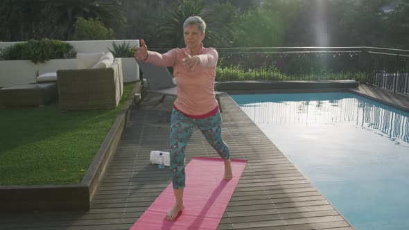 Senior woman outdoor yoga fitness