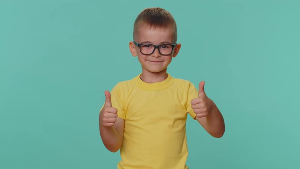 Happy Toddler Children Boy Raises Thumbs Up Agrees with Something or Gives Positive Reply Like Good