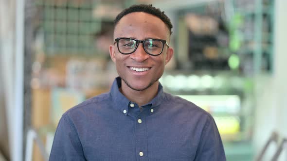 Cheerful Young African Man Smiling at the Camera