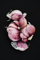 Garlic cloves on a black background. - PhotoDune Item for Sale