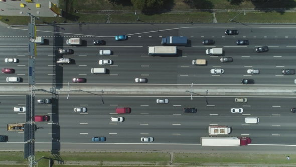 Cars on Highway in City in Sunny Summer Day