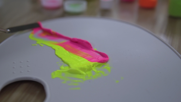 An Artist Is Mixing Together Different Colors