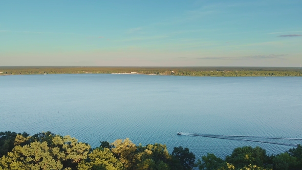 Aerial Shot of a Speed Boat on Blue Lake in the Summer
