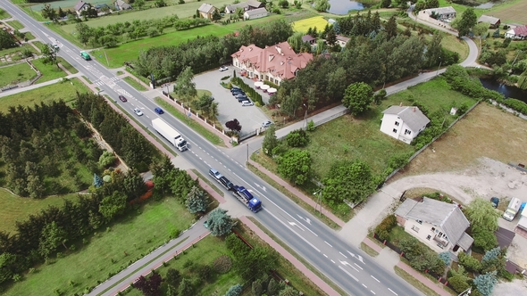 An Aerial Over a Charming Small Village Scene with Road and Hotel