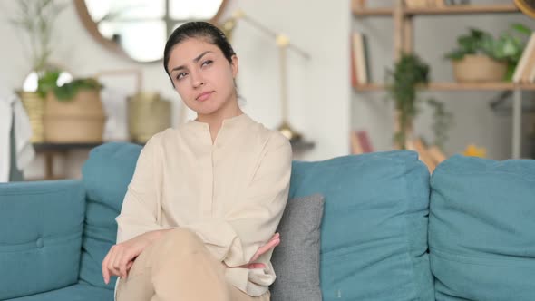 Indian Woman Sitting and Thinking on Sofa