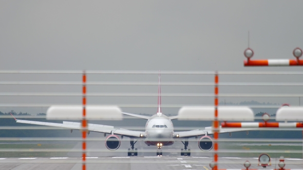 Airplane Landing at Wet Weather