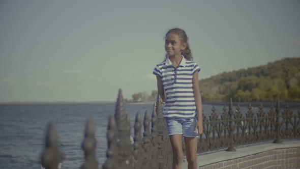 Smiling Little African American Girl Enjoying Nature