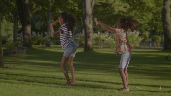 Joyful Cool Little Girls Performing Dance Moves