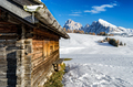 Wooden cabin in the snow with a view on the Dolomites - PhotoDune Item for Sale