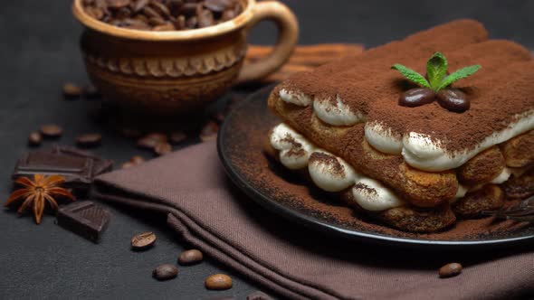 Classic Tiramisu Dessert on Ceramic Plate on Dark Concrete Background