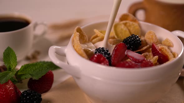 Pouring Milk Into a Bowl of Commercial Cereal