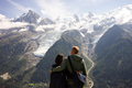 couples watching the stunning view of Mont Blanc - PhotoDune Item for Sale