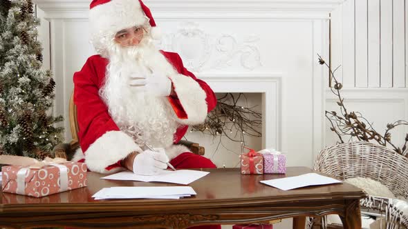 Santa Claus Thinking What To Write in His Christmas Letter