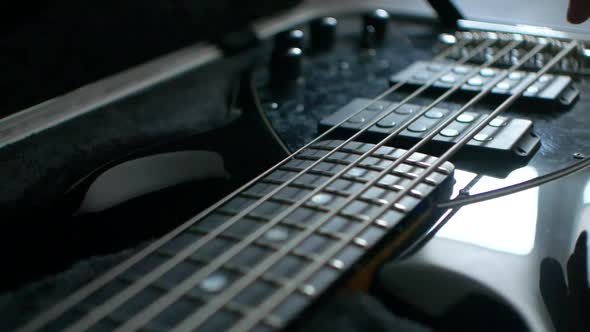 Bass guitar strings in slow-motion