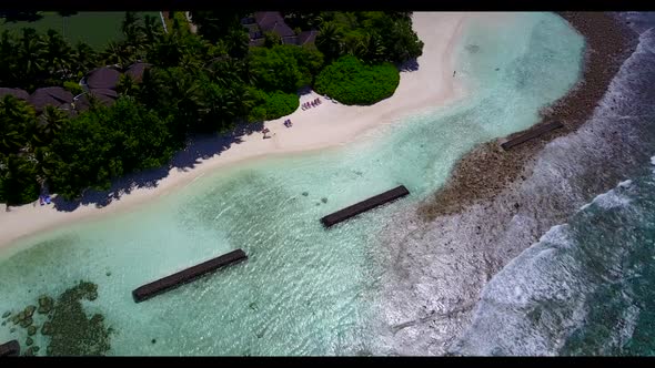 Aerial drone view tourism of idyllic coast beach break by blue ocean with clean sandy background of 