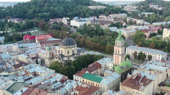 Aerial of a church in Lviv Ukraine on a summer day surrounded by European city buildings near Rynok