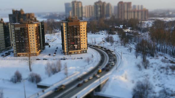 winter road to distant skyscrapers of a big city