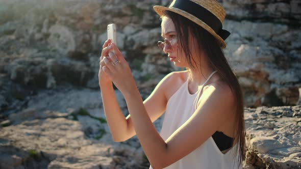 Woman is Taking Photo of Landscape By Smartphone / Videohive